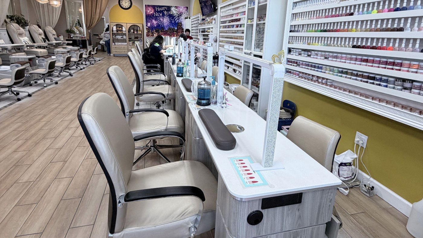 Manicure workstations beside the salon nail polish collection